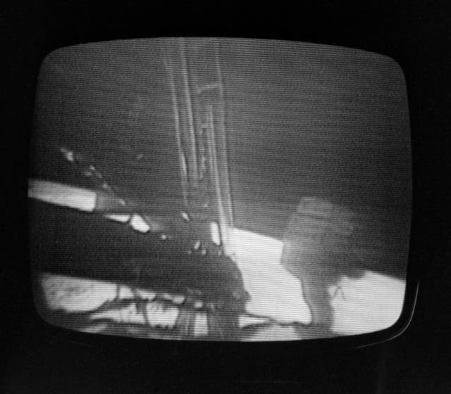 A television grab of American astronauts Neil Armstrong and Buzz Aldrin becoming the first humans to step onto the Moon (PA)