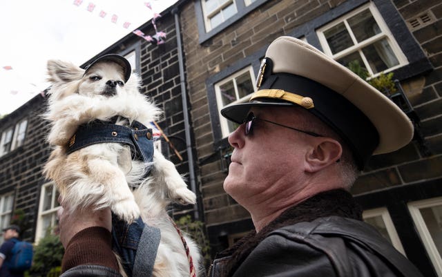 A man and his dog during the Haworth 40s weekend