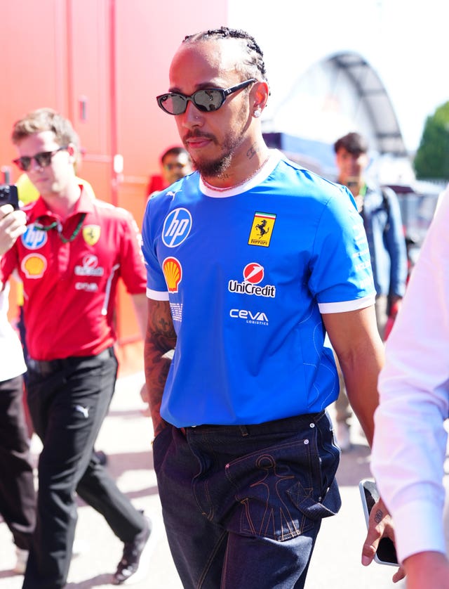 Lewis Hamilton arrives for the press conference in Monza