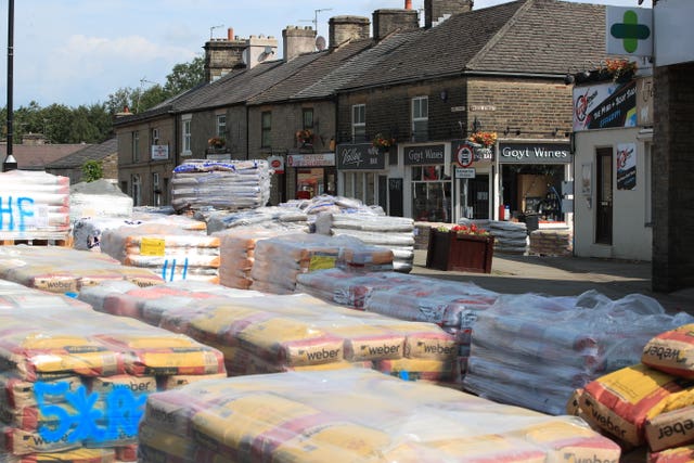 Sandbags are piled up in the evacuated village