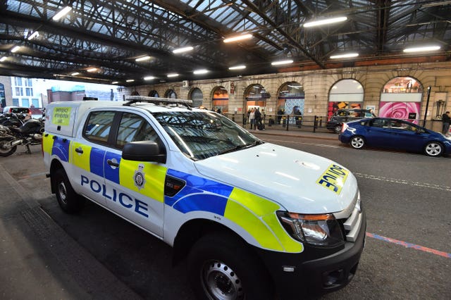 Police at Waterloo after a small parcel bomb was found (John Stillwell/PA Wire)