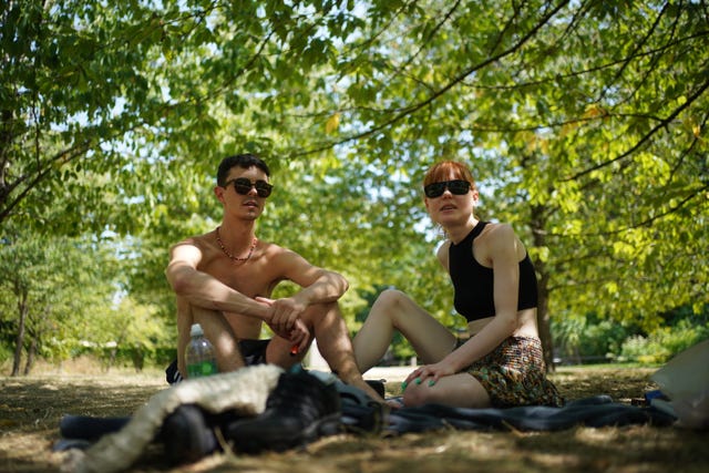 Jerome Yates and Orla Tagg make use of the shade in London’s Regent's Park