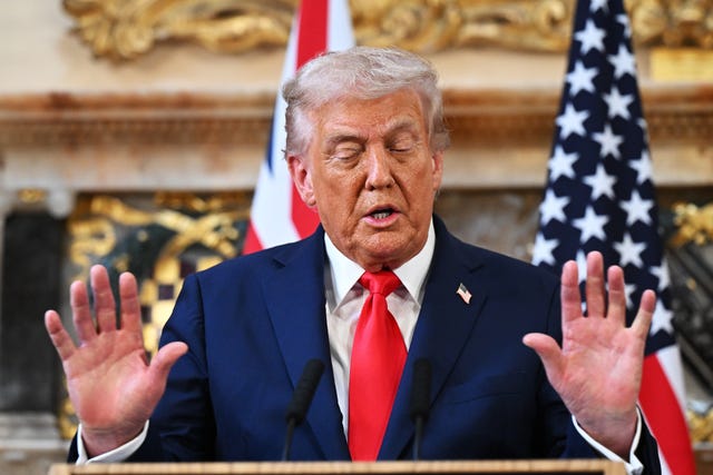 Donald Trump speaking, with both palms raised