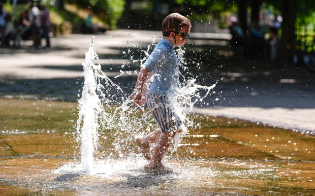 A child playing in a fountain near the river Severn in Worcester