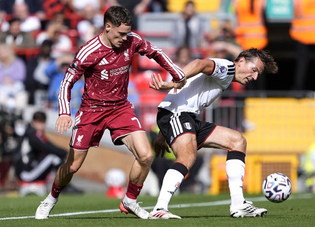 Liverpool’s Florian Wirtz (left) and Fulham’s Sander Berge battle for the ball