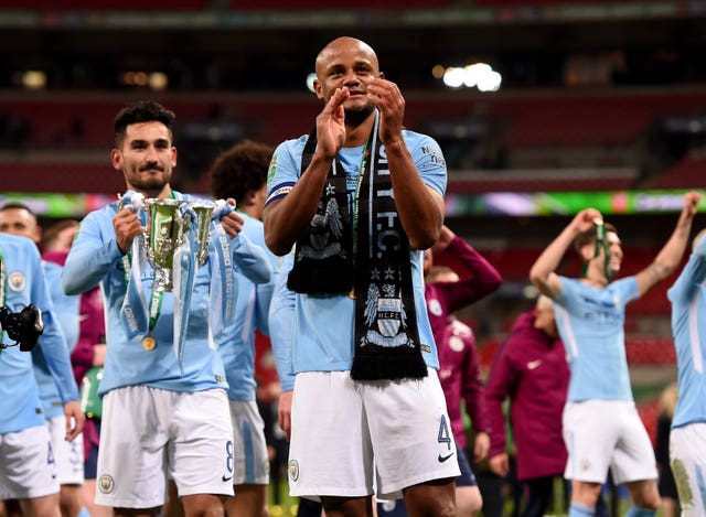 Ilkay Gundogan holds the League Cup after City beat Arsenal 3-0 in 2018