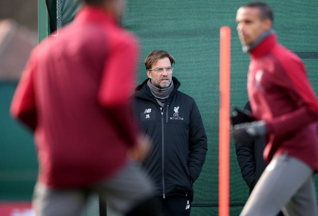 Klopp (centre) watches over the players during training