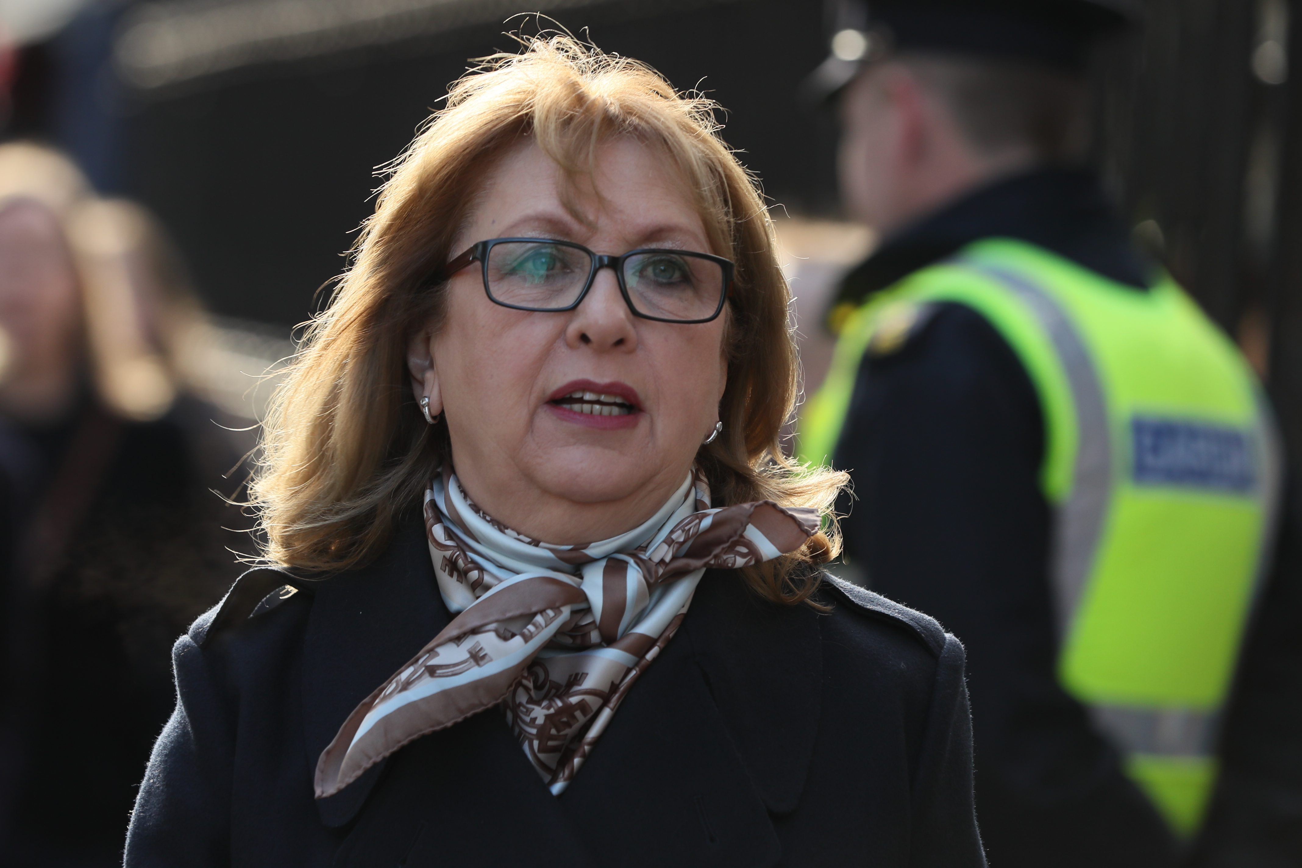 Head and shoulders shot of a a woman in glasses