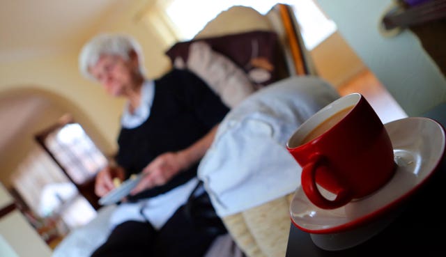 An older person sitting alone