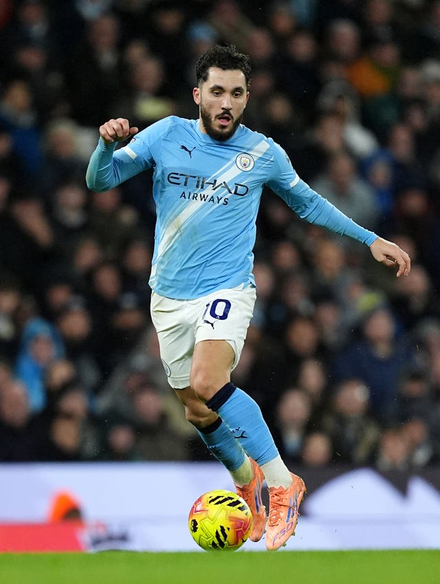 Manchester City’s Rayan Cherki runs with the ball