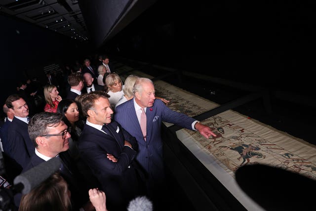 (front left to right) Prime Minister Andy Burnham, French President Emmanuel Macron, and King Charles, and (behind, left to right) former chancellor George Osborne, Culture Secretary Lisa Nandy and first lady Brigitte Macron
