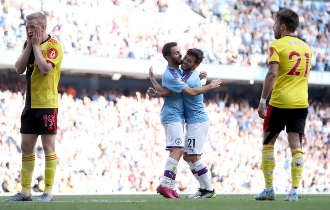 Manchester City raced into a 5-0 lead in just 18 minutes but fell short of the Premier League's record victory in an 8-0 drubbing of Watford. The expression of Will Hughes (left) will have been shared by many in the Watford end of the ground
