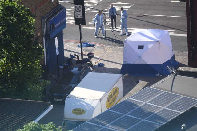 Forensic officers examine the van used in the attack (Victoria Jones/PA)