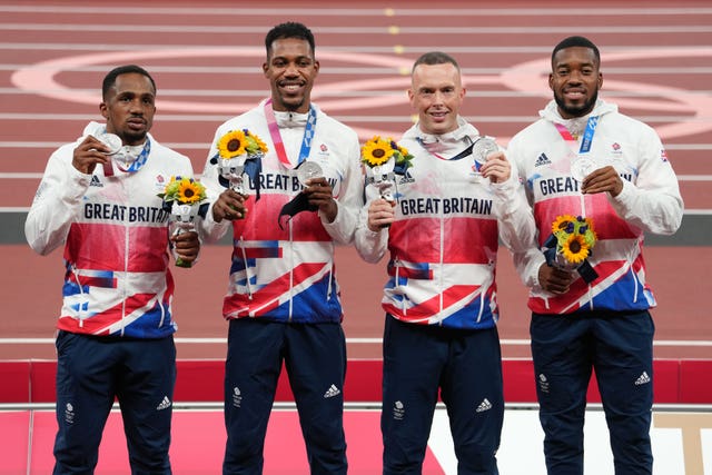 Ujah, left, with team-mates Zharnel Hughes, Richard Kilty and Nethaneel Mitchell-Blake on the podium in Tokyo