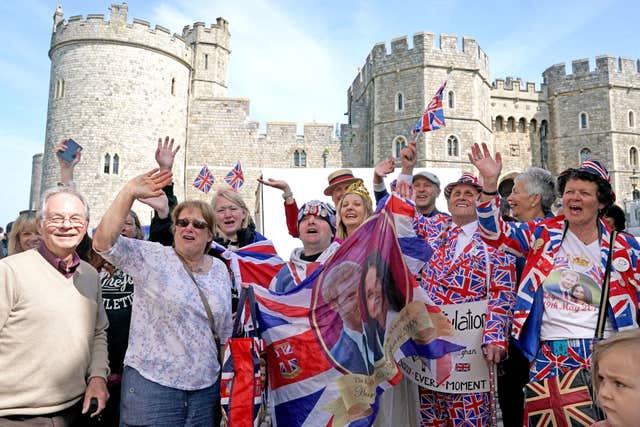 Three cheers: Excited wedding fans get in the party spirit (Owen Humphreys/PA)