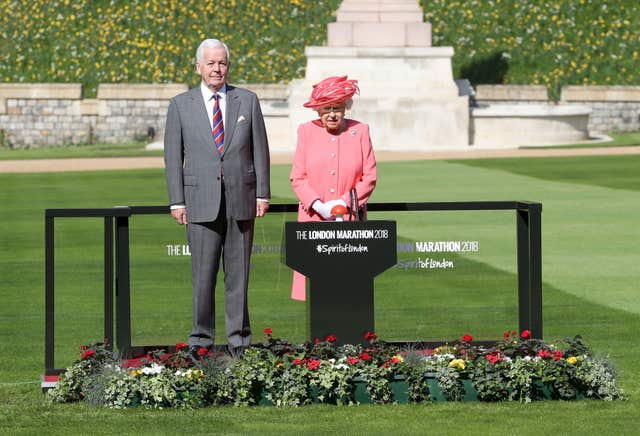 The Queen with Sir John Spurling, chairman of London Marathon Events Ltd, before she pressed a button in Windsor Castle, Berkshire to start the London Marathon (Chris Jackson/PA)