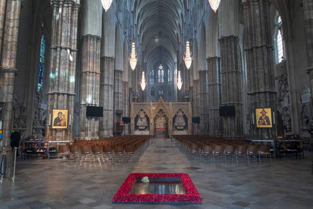 The grave is marked out by poppies in Westminster Abbey (Victoria Jones/PA)