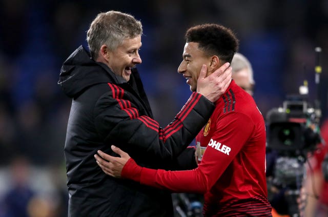 Ole Gunnar Solskjaer congratulates Jesse Lingard after the win over Cardiff (Nick Potts/PA).
