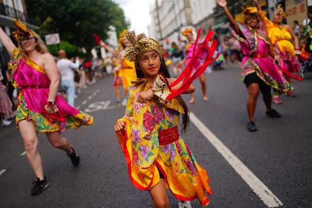 Performers during the children’s parade on Family Day at the Notting Hill Carnival in London