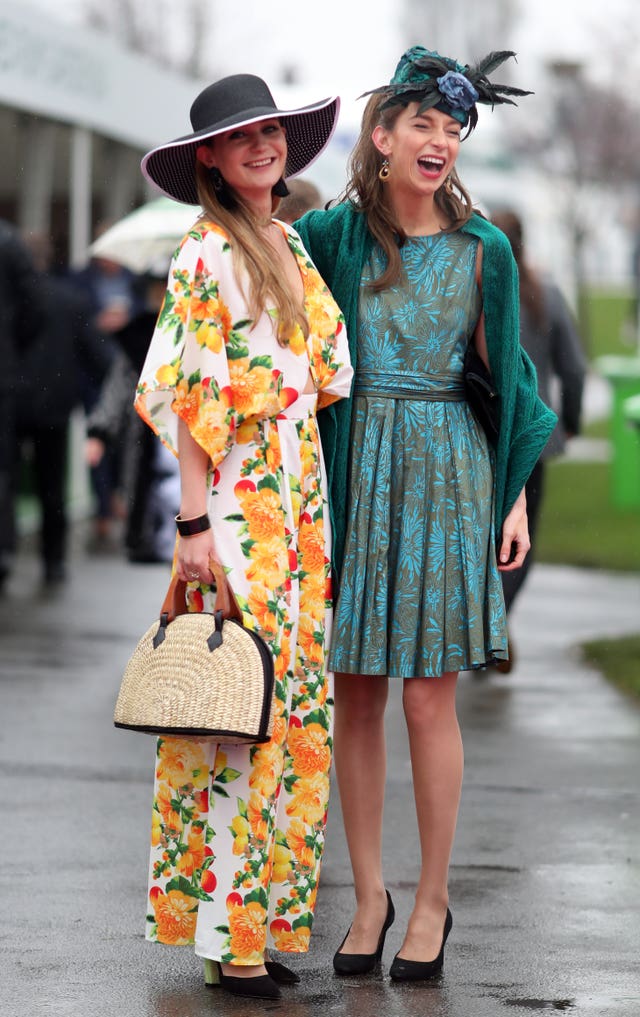 Bright outfits cheered up a wet day at Aintree (David Davies/PA)