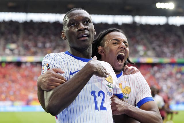 Randal Kolo Muani, left, celebrates