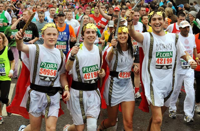 A group of funrunners cross Tower Bridge during the London Marathon 2008