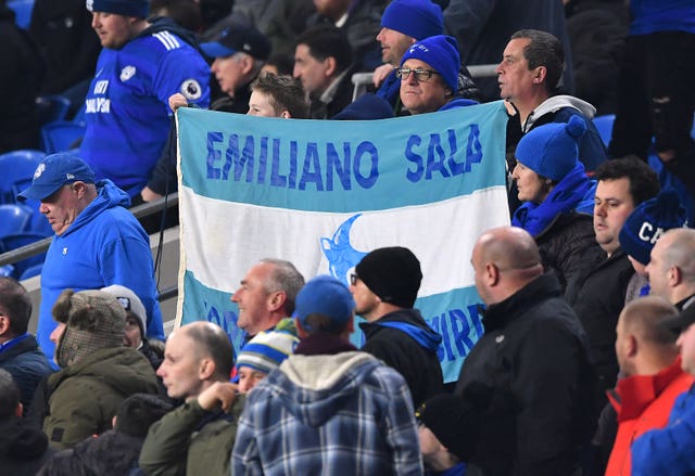 Cardiff fans hold aloft a banner in tribute to Sala