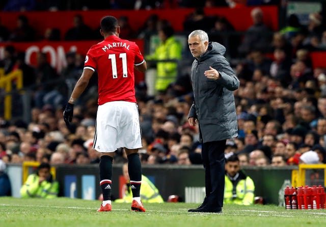 Jose Mourinho, right, speaks to Anthony Martial