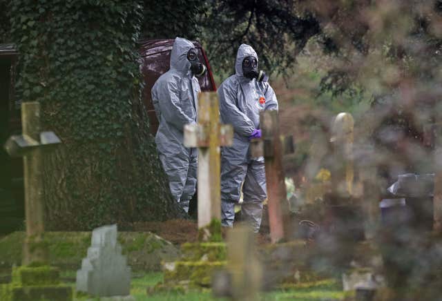 Forensic officers in gas masks at the London Road cemetery during the Salisbury incident (Andrew Matthews/PA)
