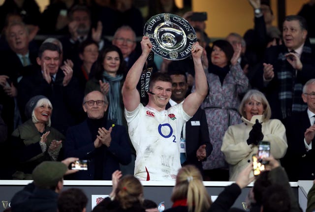 England captain Owen Farrell lifts the Triple Crown after his side's 33-30 victory over Wales at Twickenham