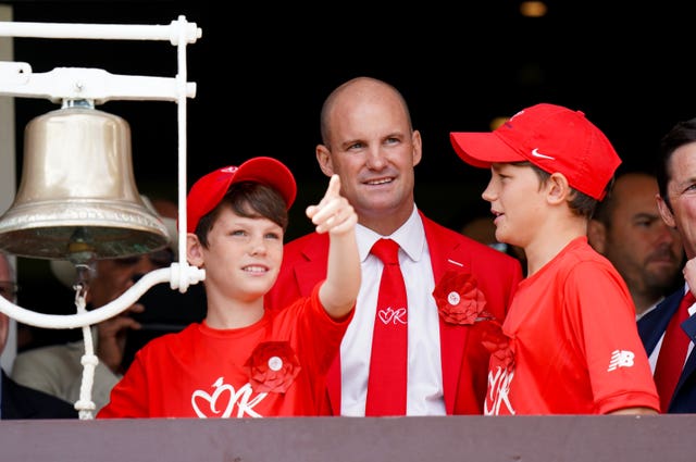Andrew Strauss rang the bell to start day two with sons Luca and Sam as the ground turned red in aid of the Ruth Strauss Foundation