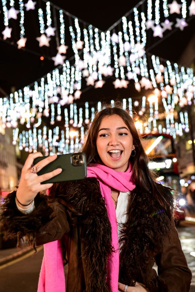 A member of the public attends the Oxford Street Christmas lights switch-on