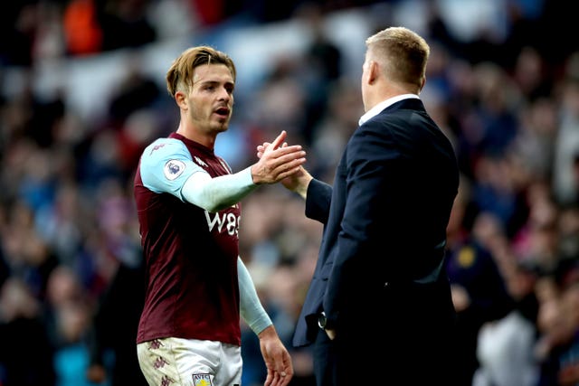 Jack Grealish, left, is congratulated by his manager Dean Smith