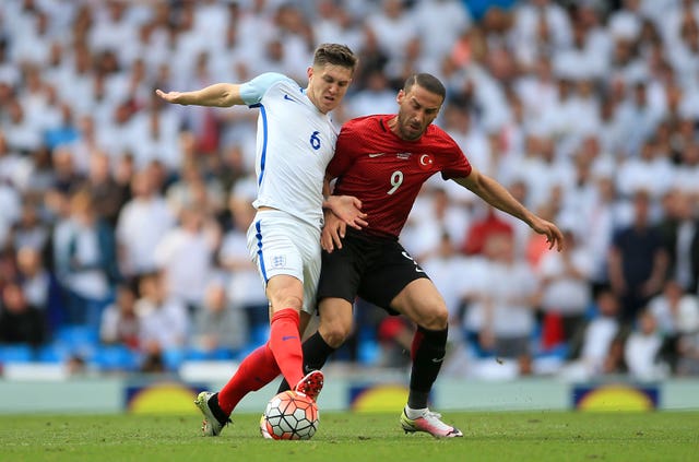 Everton target Cenk Tosun, right, is a Turkey international