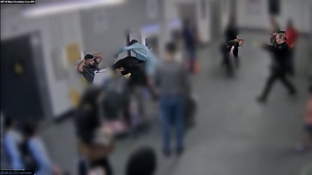 CCTV still of the alleged assault of three police officers at Manchester Airport