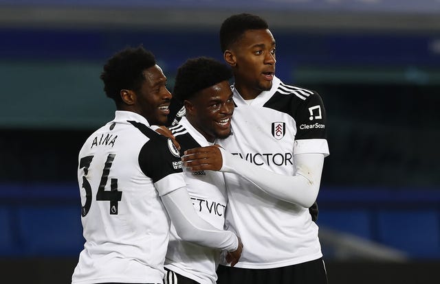 Fulham's Josh Maja (centre) celebrates with Ola Aina (left) and Tosin Adarabioyo.