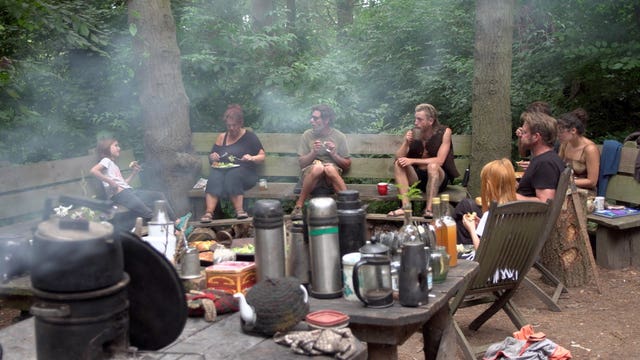 Kirsty, second left, and Nick Tizard, right, who moved from Devon with their family to Tinkers Bubble, a near self-sufficient community in south Somerset