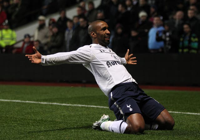 Jermain Defoe slides on his knees after scoring 