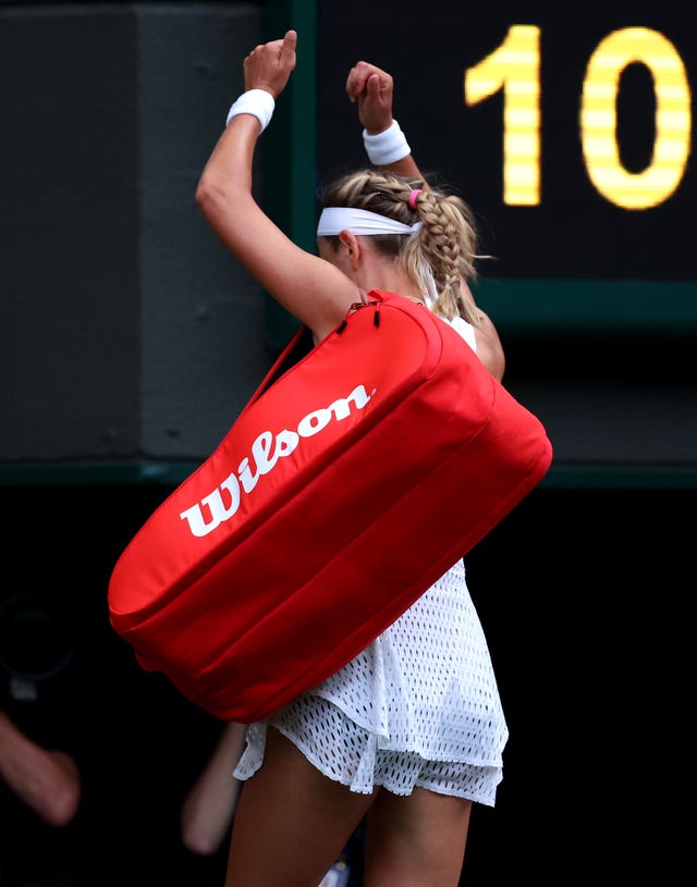 Victoria Azarenka reacts to being booed as she walks off Centre Court following her defeat