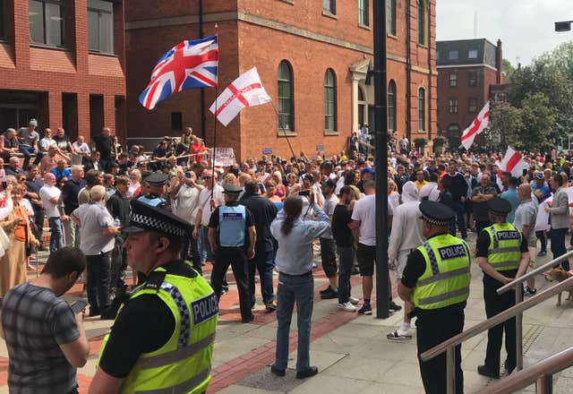 Police and protesters outside Leeds Crown Court