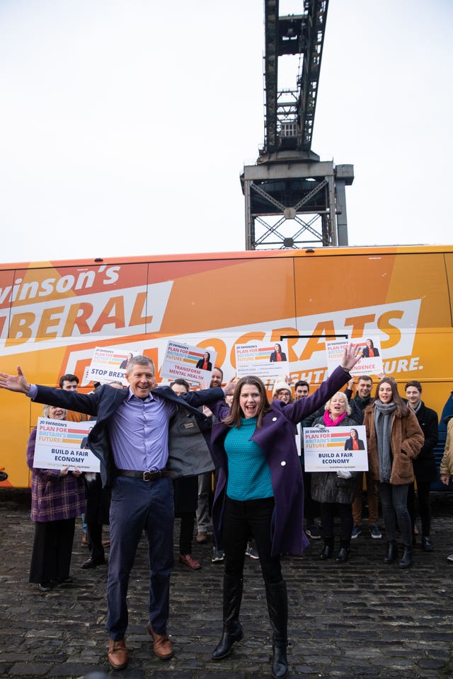 Lib Dem leader Jo Swinson with Scottish Lib Dem leader Willie Rennie in front of the Finnieston Crane in Glasgow