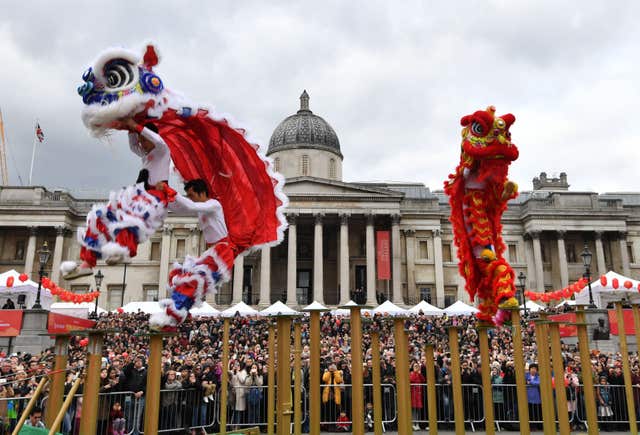 The Flying Lions performing for the crowds in Trafalgar Square (John Stillwell/PA)