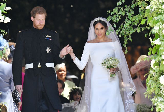 Prince Harry and Meghan Markle walk down the steps of St George’s Chapel in Windsor Castle after their wedding.