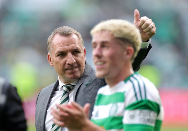 Celtic manager Brendan Rodgers, left, celebrates at full-time against Rangers