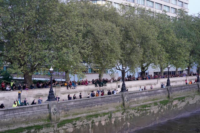 Hospital staff join members of the public outside St Thomas’ Hospital in London