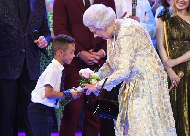 Flowers for the birthday girl from the birthday boy, seven year old Mason (John Stillwell/PA)