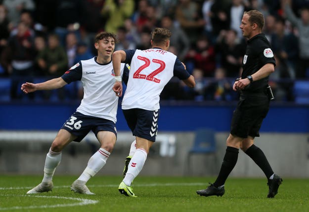 Bolton’s Dennis Politic celebrates opening the scoring