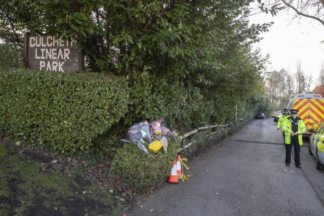 Floral tributes at the scene in Culcheth Linear Park in Warrington, Cheshire