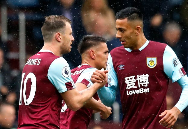 Ashley Barnes, left, is congratulated on his opening goal