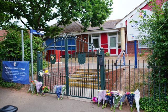 Floral tributes at the entrance to Minehead Middle School in Somerset